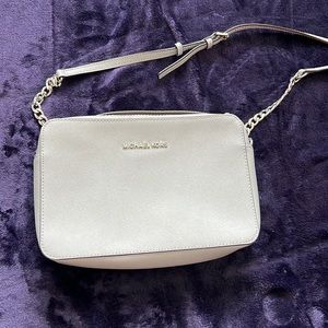 Gently used authentic Michael Kors light gray crossbody bag